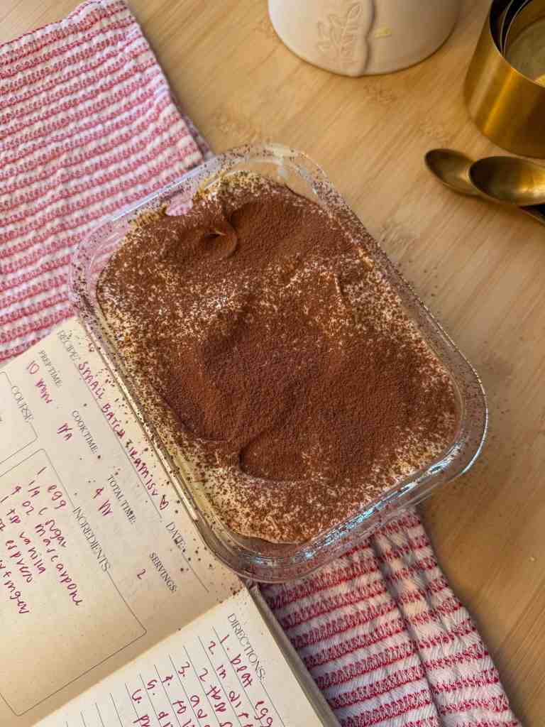 small batch tiramisu ready to be enjoyed on a wooden table