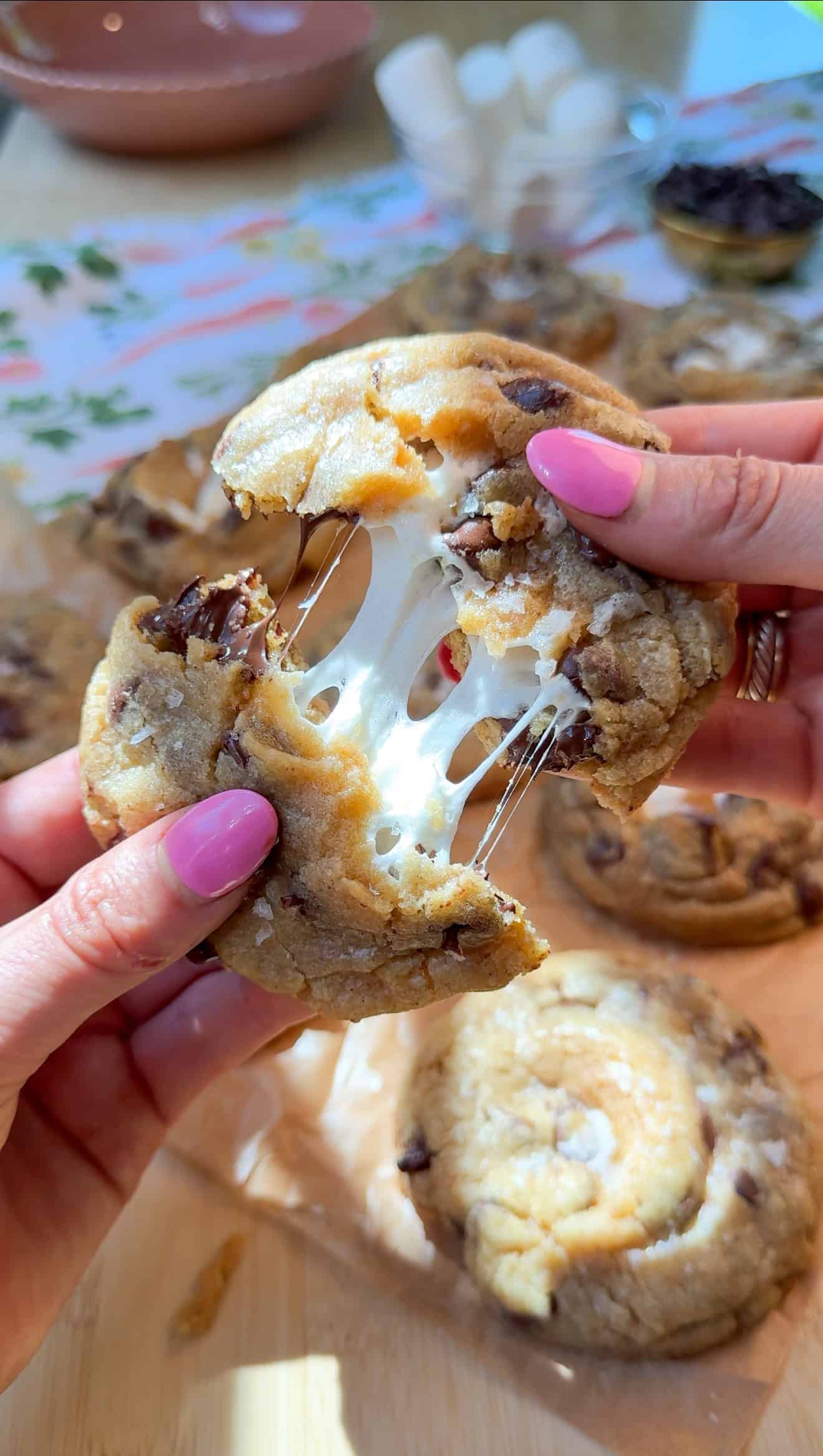 me pulling apart my smores cookies with the gooey marshmallow center