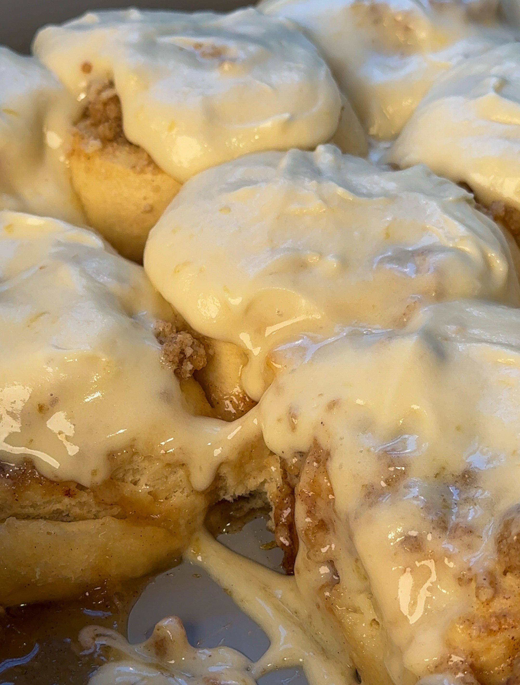 close up of my peach cobbler cinnamon rolls in a pan